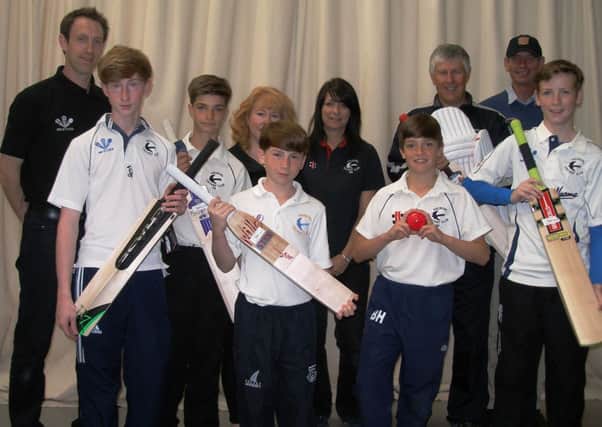 Members of Arundel Cricket Club's colts teams are pictured with their new equipment and with coach Tim Pitt, Rotarian Martin Duncan and staff at Game, Set and Match