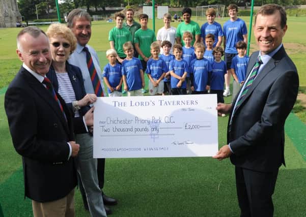 Lord Taverners Neil and Susanne Holloway and Nigel Smith present Graeme Bennison, chairman of the Priory Park club, with Â£2,000 for much-needed equipment   Picture by Louise Adams C130825-1