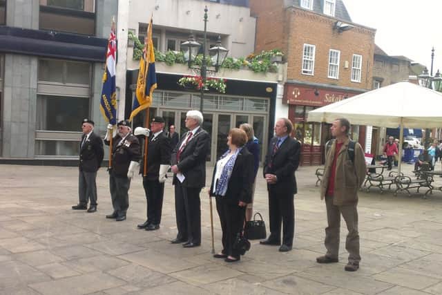 Armed Forces Day flag raising ceremony in the Carfax at the War Memorial in Horsham.