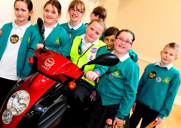 JPCT 260313  Junior Citizens Week, Drill Hall, Horsham. Pupils from Kingslea Primary School with an electric scooter. Photo by Derek Martin