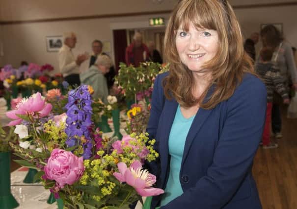 Jayne Pumfrey gets a first for vase of mixed flowers            PHOTO: Graham Franks