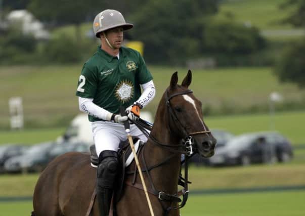 Salkeld (green) v Twelve Oaks (white) in a Veuve Clicquot Gold Cup Polo match on Lawns 2 at Cowdray Park Polo Club on Sunday 23 June 2013