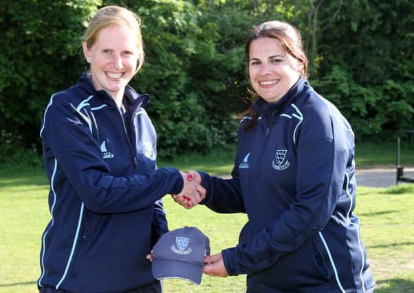 Alexia Walker receives Sussex women's cap number 112 from Charlotte Burton. Picture courtesy Sussex CCC