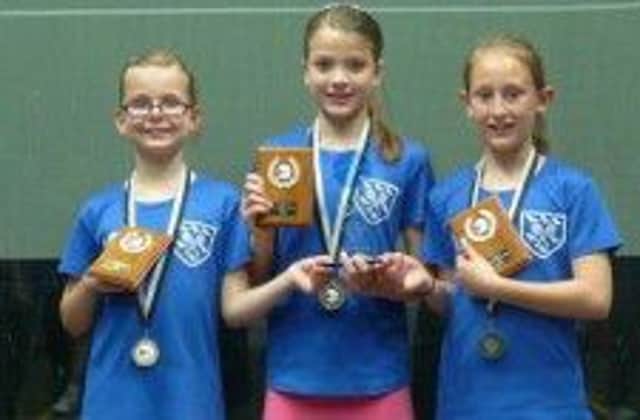 torrie malik (middle) with sussex u11 squash team-mates laura page and florrie edwards