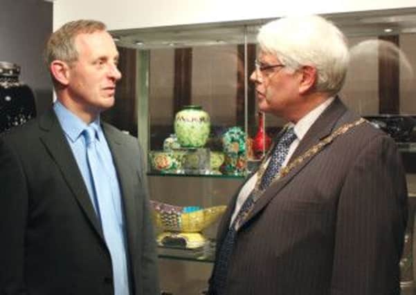 Jeremy Knight, Curator, and Philip Circus, Chairman of Horsham District Council, opening the Japanese Treasures: Cloisonné Enamels from the V&A at Horsham Museum & Art Gallery.