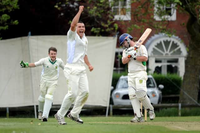 Burgesss Hill (bowling) v Hassocks and Keymer. Scott Woods and luck Vick celebrate the wicket of Joe Barnes-Gratton