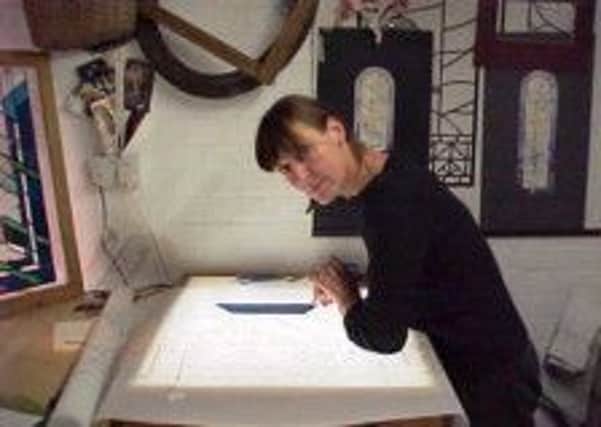 Sue Wallis at work on one of her stained glass pieces before she died in September 2011