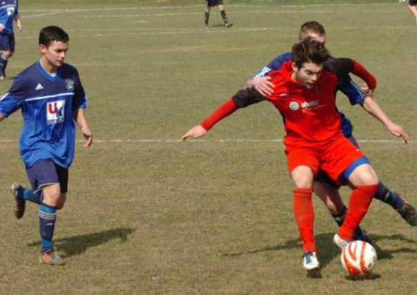 Olly Lockyer on the ball for Rye United in their 2-1 derby win away to Sidley United on Easter Monday