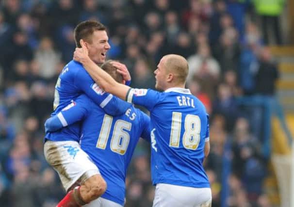 Jed Wallace, left, celebrates scoring for Pompey against Coventry in March