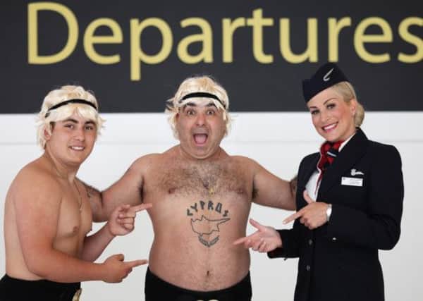 LONDON, UK: 
British Airways Ambassador Laura Ross helps Stavros Flatley get ready for brand new flights between London Gatwick and Larnaca, flying three times a week. 

The new service starts on June 30, 2013 just in time for the peak summer holiday season and is in addition to the flights the airline offers from London Heathrow airport. 

(Picture by Nick Morrish/British Airways)
