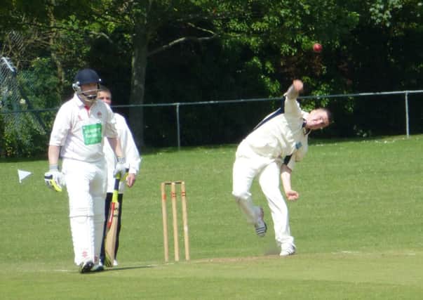 Ryan Dowdeswell bowls for Iden watched by Rye batsman James Hamilton