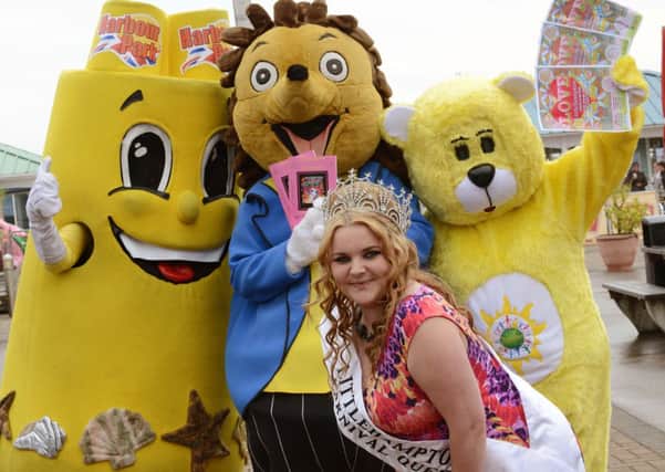 Littlehampton Carnival Queen Megan Swift with a trio of mascots, Sandy Castle, from Harbour Park, the carnival's Hampton the Hedgehog, and Ray Bear, of Raydar