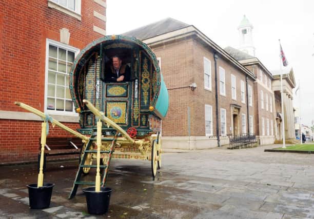 Greg Yates with a barrel top wagon outside Worthing museum