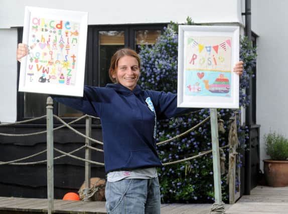 Anna Seager, of Little Crab Designs, with some of her nursery pictures W28044H13