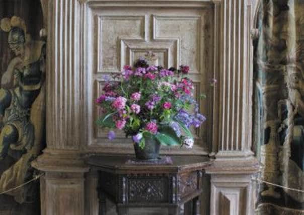Cascading summer flowers in the Great Hall at Parham.