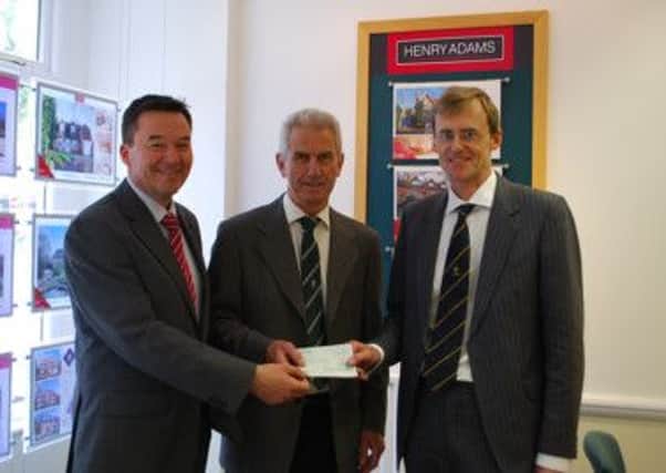 Howard Ball & Robert Crawford Clarke of Henry Adams with Chris Wright (centre), chairman of Horsham Rugby Club