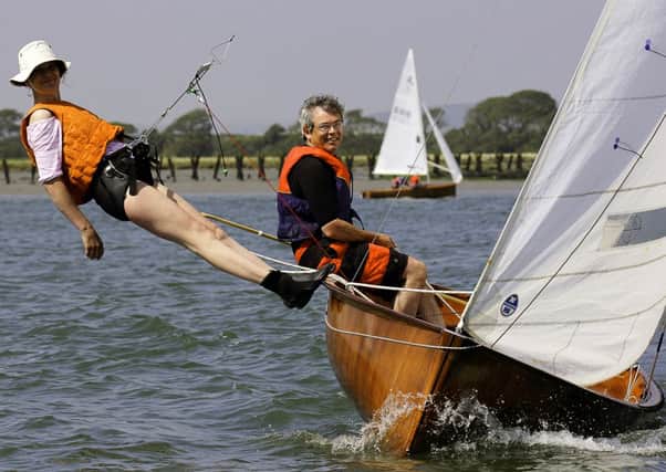 Competitors Kate Middleton and Simon Meacock racing in the Bosham Classic Boat Regatta  Picture by Chris Hatton