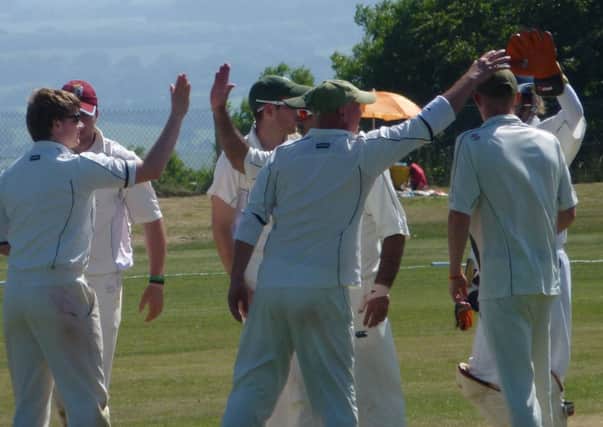 Crowhurst Park celebrate the fall of a St James's Montefiore wicket. Picture by Simon Newstead