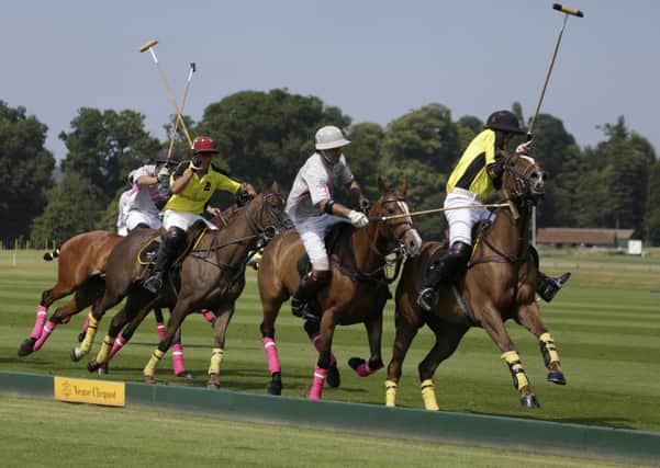 Cortium Jaeger Le Coultre (yellow) v Talandracas (grey) in a Veuve Clicquot Gold Cup Polo Match for the Cooch Behar Cup on Lawns 2 at Cowdray Park Polo Club Picture by Clive Bennett