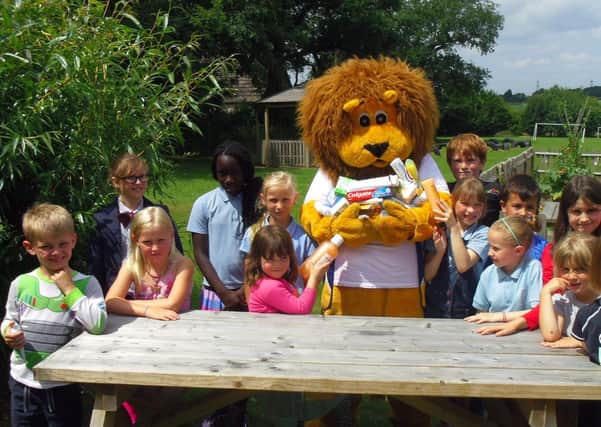 Pupils are pictured with Leo, the Lions' mascot