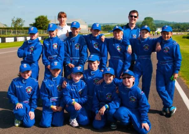 The River Beach team in their smart racing suits