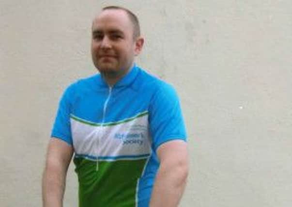 Brad Dickinson  prepares for his third cycling challenge