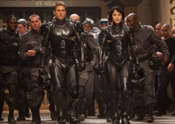 Undated Film Still Handout from Pacific Rim. Pictured: CHARLIE HUNNAM as Raleigh Beckett and RINKO KIKUCHI as Mako Mori. See PA Feature FILM Film Reviews. Picture credit should read: PA Photo/Warner Brothers. WARNING: This picture must only be used to accompany PA Feature FILM Film Reviews.