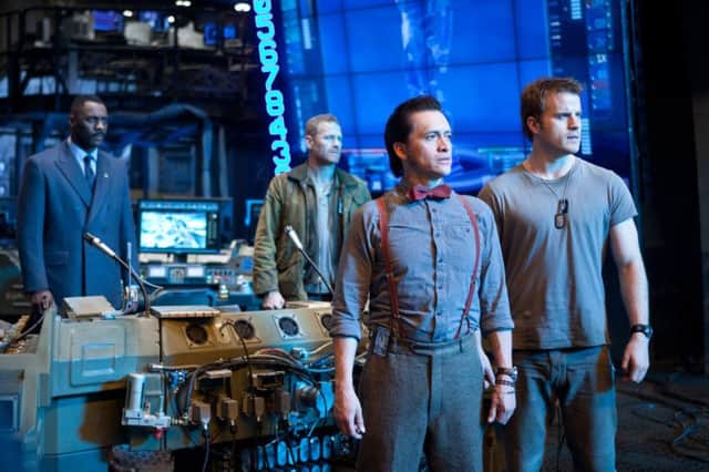 Undated Film Still Handout from Pacific Rim. Pictured: CHARLIE DAY as Dr Newton Geiszler, MAX MARTINI as Herc Hansen, IDRIS ELBA as Stacker Pentecost and ROBERT KAZINSKY as Chuck Hansen. See PA Feature FILM Film Reviews. Picture credit should read: PA Photo/Warner Brothers. WARNING: This picture must only be used to accompany PA Feature FILM Film Reviews.