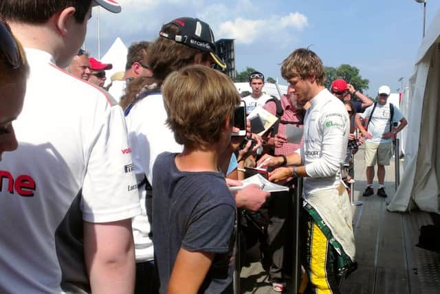 Signing autographs at Festival of Speed 2013