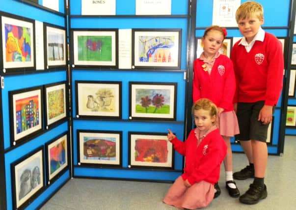 Pupils with some of the art on display at the Arundel CE Primary School