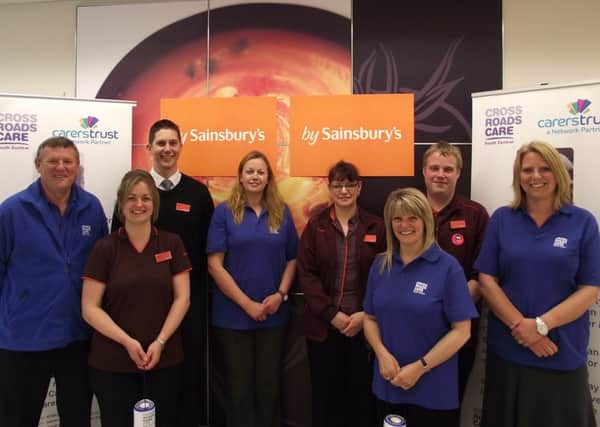 Staff from Sainsbury's, Littlehampton and Crossroads Care mark the launch of the fundraising partnership, with Crossroads chief executive Eric Geddes (far left)