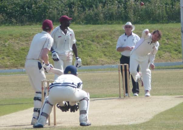 Freddie Hulbert bowls for Hastings Priory against Preston Nomads. Picture by Simon Newstead