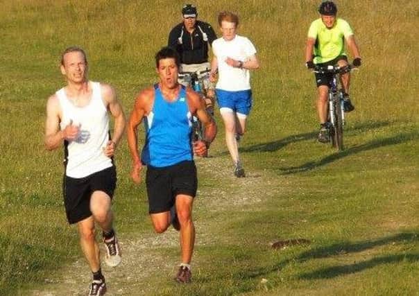 burgess hill runners- Darryl Webb, Paul Sargent and James Collins storming towards Ditchling Beacon (