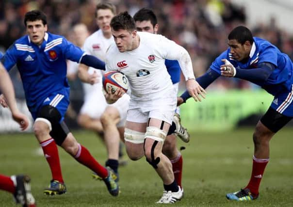 Jack Clifford escaping a tackle against France U20s (Photo by Ben Hoskins/Getty Images)