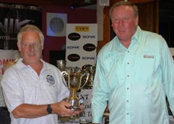 Bill Ellis receives the ICSA Gold Cup from John Thomson