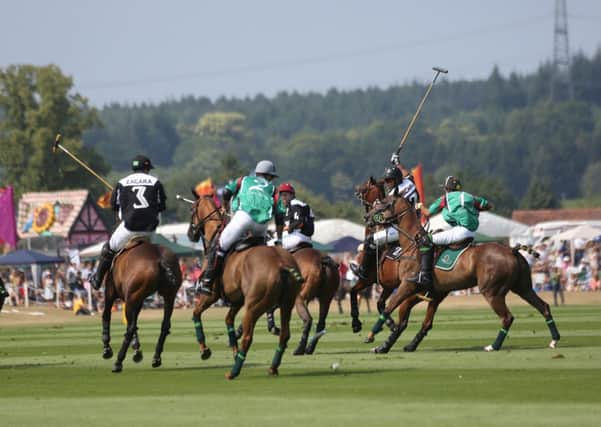 Zacara (black) take on Dubai (green) in the Veuve Clicquot Gold Cup final at Cowdray Park  Picture by Clive Bennett