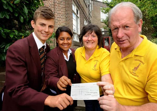 Head Boy and Head Girl of Oathall College - Nile (correct) Jones and Shannon King hand over a cheque to Lesley and Roger Dann of Harambee For Kenya charity