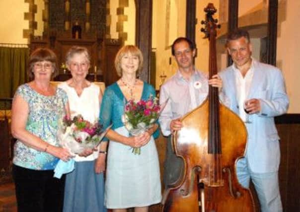 (From left) Wendy Dorkings, Churchwarden; Mags Fisher, Organiser; Julie Roberts, Gary Holder, Airs and Graces ; Mark Jennings, Classical guitarist.