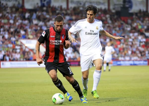 AFC Bournemouth defender Steve Cook rubs shoulders with Real Madrid star Kaka. Picture courtesy AFC Bournemouth