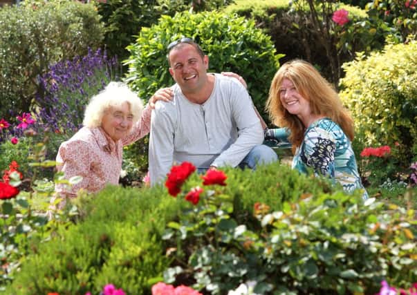 Hazel Lingard (left) with gardener Chris Collins (centre) and Southern Waters Beverley Thompson (right)