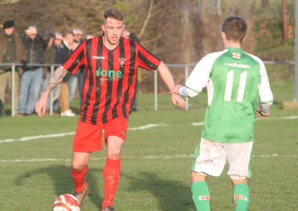 Sean Kelly, pictured playing for Rye United against Guernsey last season, struck twice for Hastings United against a Gillingham XI on Saturday. Picture by Terry S. Blackman