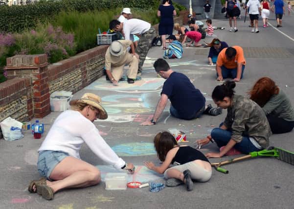 Being creative at the Chalk on the Prom event, with artists of all ages  PHOTO: Stephen Goodger      L31581H13