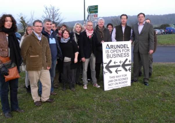 Arundel traders with the town's district councillor Paul Dendle (far right) protest against the impact of the roadworks last year