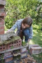 RSPB Giving Nature a Home campaign.  Stills from television commercial, London NW10. Girl in garden building Mini Beasties B&B. May 2013. Photo: Eleanor Bentall Tel: 07768 377413.