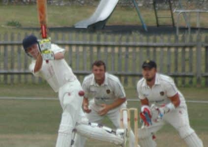 Shawn Johnson drives spinner Joe Adams for four during Bexhill's game away to Glynde & Beddingham last weekend. Picture courtesy Andy Hodder
