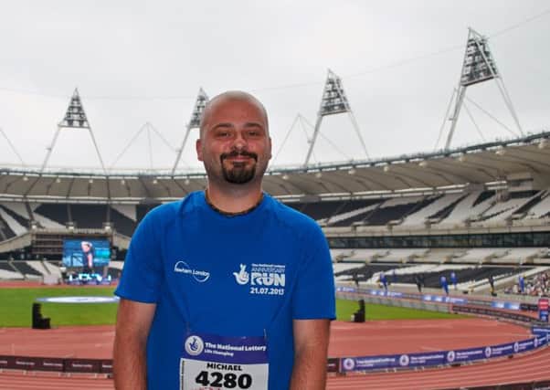 Mike Sadler after finishing his five-mile Olympic anniversary run, at the Olympic Stadium, last month