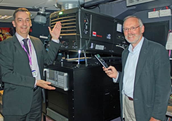 Nick Mowat, General Manager at The Capitol, and Cllr Jonathan Chowen, Horsham District Councils Cabinet Member for Arts, Heritage and Leisure, with the new projector (submitted).