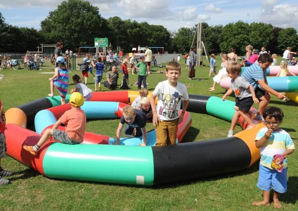 Sunshine and plenty of fun - The play activities organised by the play rangers get under way at West Park.    Picture by Louise Adams C131093-1