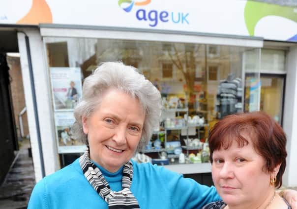JPCT 090413 S13150629x Horsham. Carfax. Age UK. Eileen Brumby, manager, and Helena Holmwood -photo by Steve Cobb