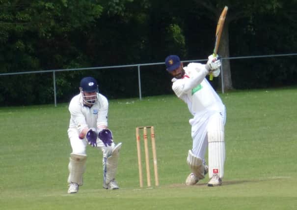 Sandun Dias thumps one through the covers for four watched by Iden wicketkeeper Scott Price earlier in the season. Picture by Simon Newstead